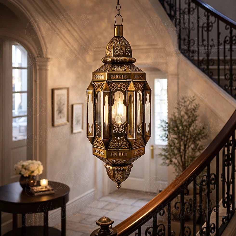 Handmade Moroccan brass oriental lantern pendant light hanging in a refined European staircase interior setting