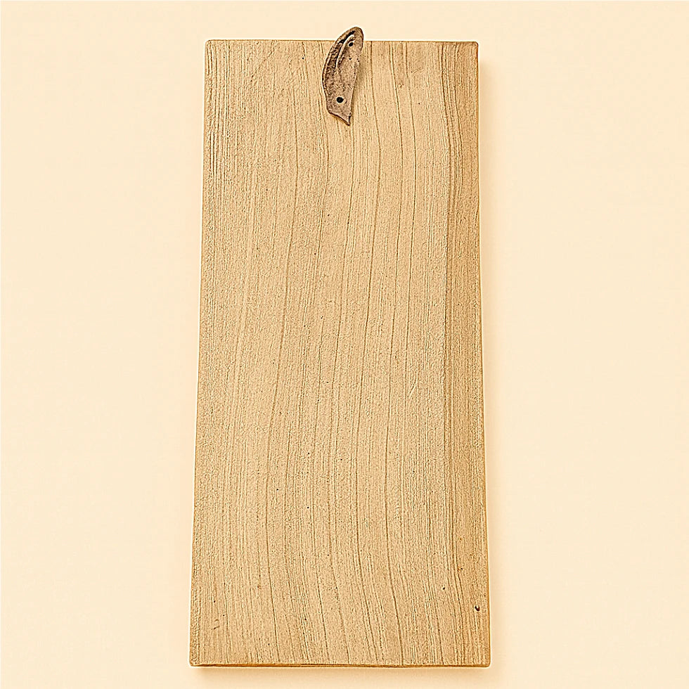 Back view of handcrafted Berber cedar wood amulet showing natural wood grain and leather hanging strap – Online Medina