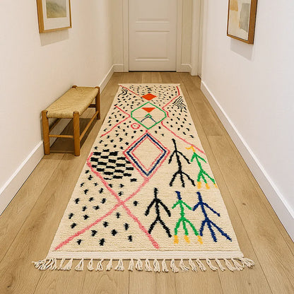 A long Azilal wool runner rug with traditional Berber motifs displayed in a minimalist hallway, giving the space character, color and Moroccan authenticity.
