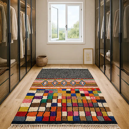 Boujaad rug with Sahara-influenced motifs and colorful handwoven details placed in a modern walk-in closet with natural light