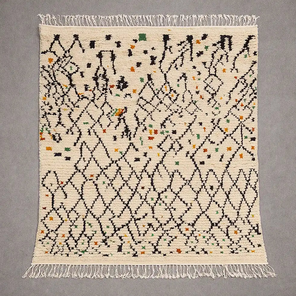 Flat view of a Boujaad Azilal Berber rug handwoven in natural wool, cream base with black geometric lines and colorful accents