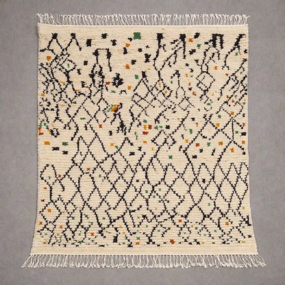 Flat view of a Boujaad Azilal Berber rug handwoven in natural wool, cream base with black geometric lines and colorful accents