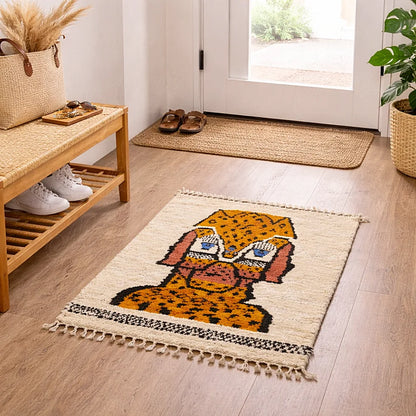 Small handmade Moroccan rug with animal motif placed in an entryway