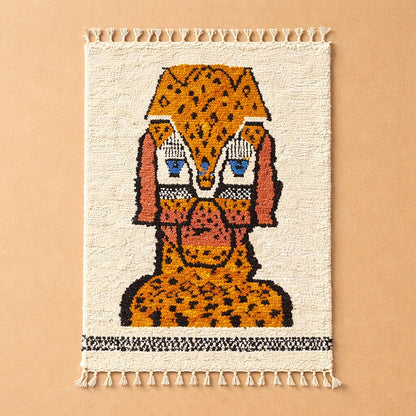 Handmade Moroccan rug with animal motif photographed on a plain background