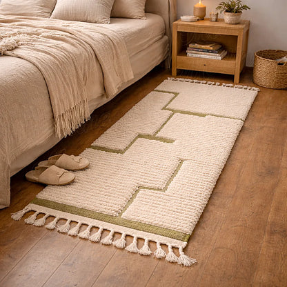 Berber wool runner with green abstract pattern in a bedroom, soft textured moroccan rug beside the bed