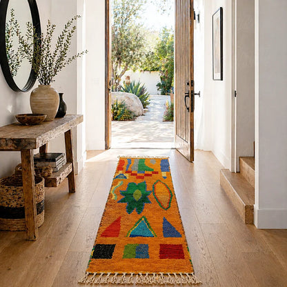 Colorful Boujad berber runner rug with symbolic geometric motifs in warm natural entryway decor