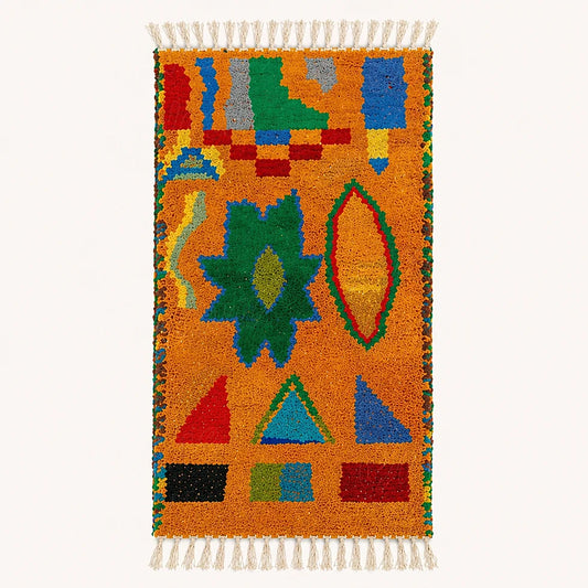Top view of handmade Boujad berber rug with colorful symbolic geometric patterns and textured wool