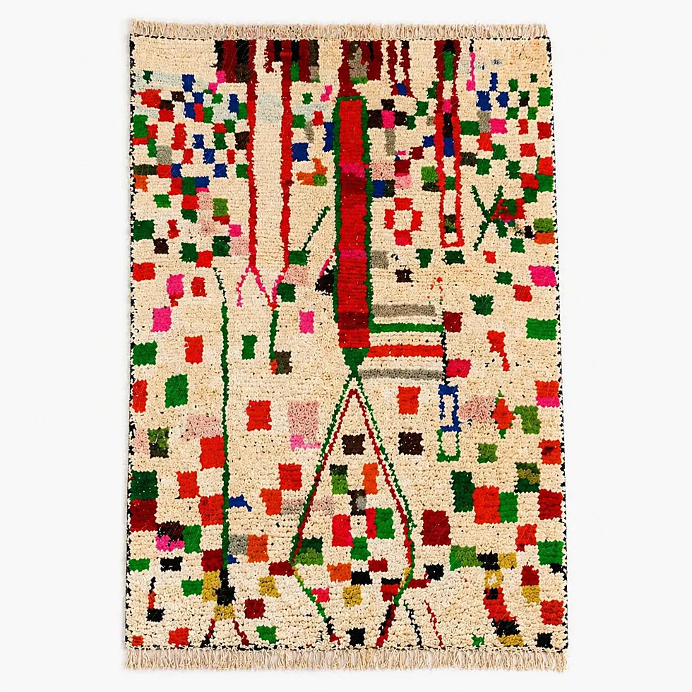 Colorful Azilal berber rug with symbolic geometric pattern on cream wool, shown in flat lay view