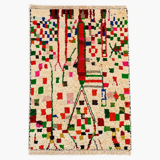 Colorful Azilal berber rug with symbolic geometric pattern on cream wool, shown in flat lay view