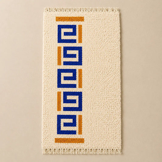 Modern Moroccan Berber wool rug with blue geometric motifs on plain background