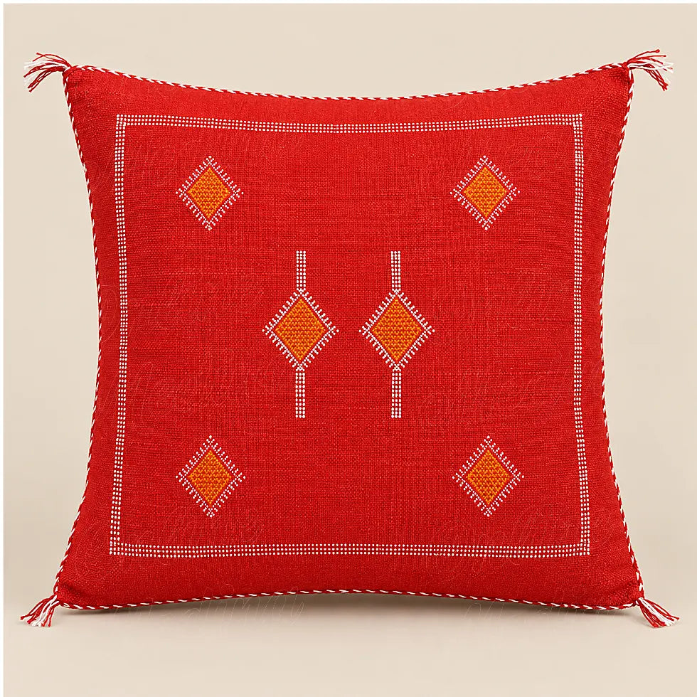 Coussin sabra rouge à losanges orange sur fond beige uni