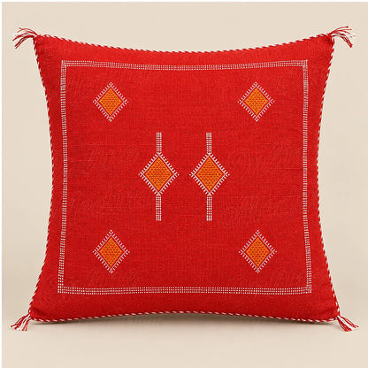 Coussin sabra rouge à losanges orange sur fond beige uni