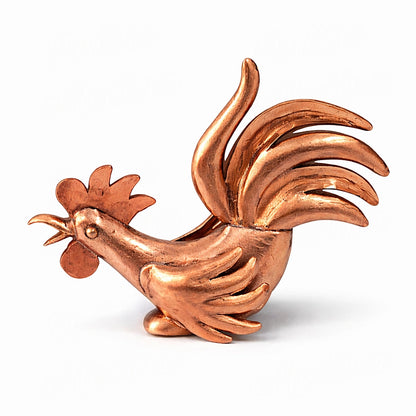 Handmade Moroccan copper rooster sculpture in horizontal compact stance with detailed artisan metal texture