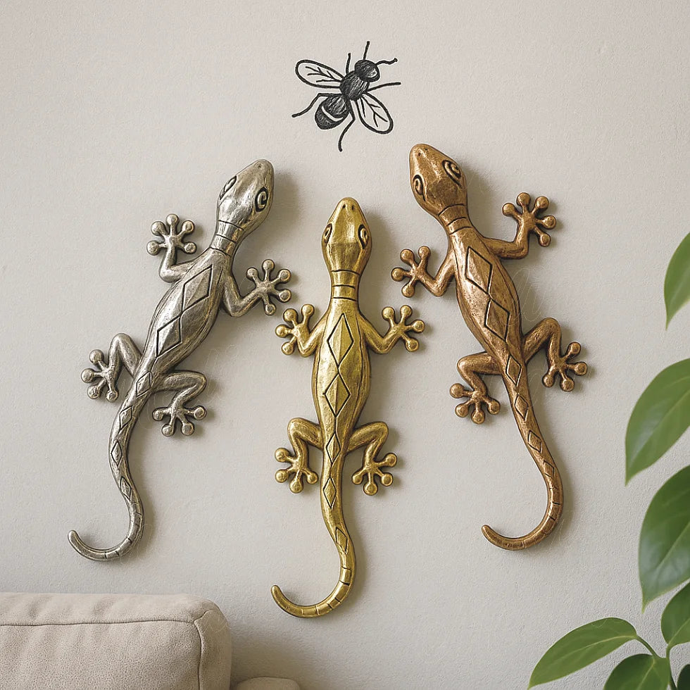 Set of three metallic wall geckos in gold, copper, and silver chasing a fly, Moroccan artisan decoration