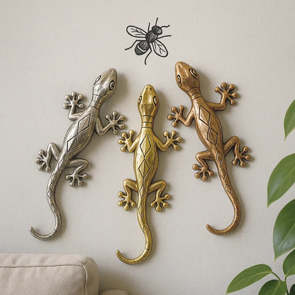 Set of three metallic wall geckos in gold, copper, and silver chasing a fly, Moroccan artisan decoration
