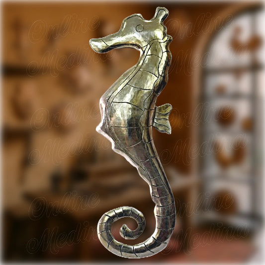 Moroccan wall seahorse made of hammered silver-tin alloy, elegant marine decoration by a master craftsman in Marrakech.