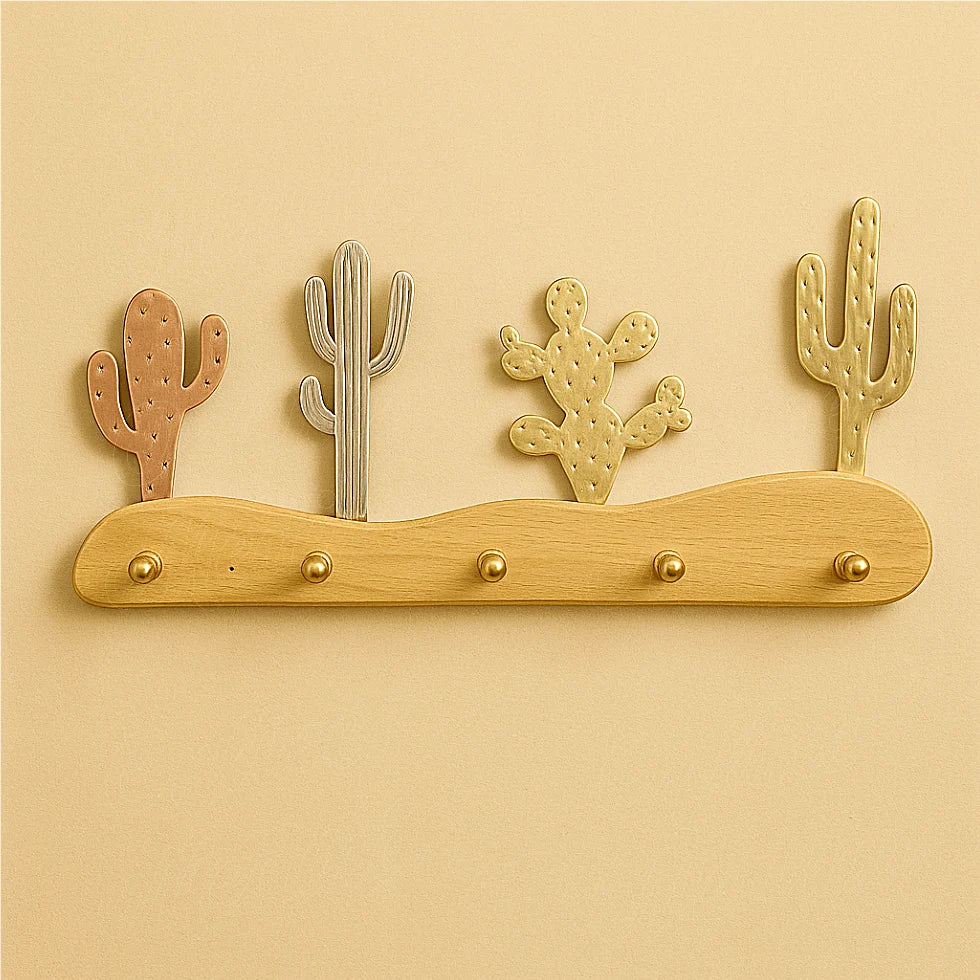 Artisanal cactus-shaped wall hook handmade in Morocco, mixed metals on a natural beech wood base, minimalist beige background for e-commerce