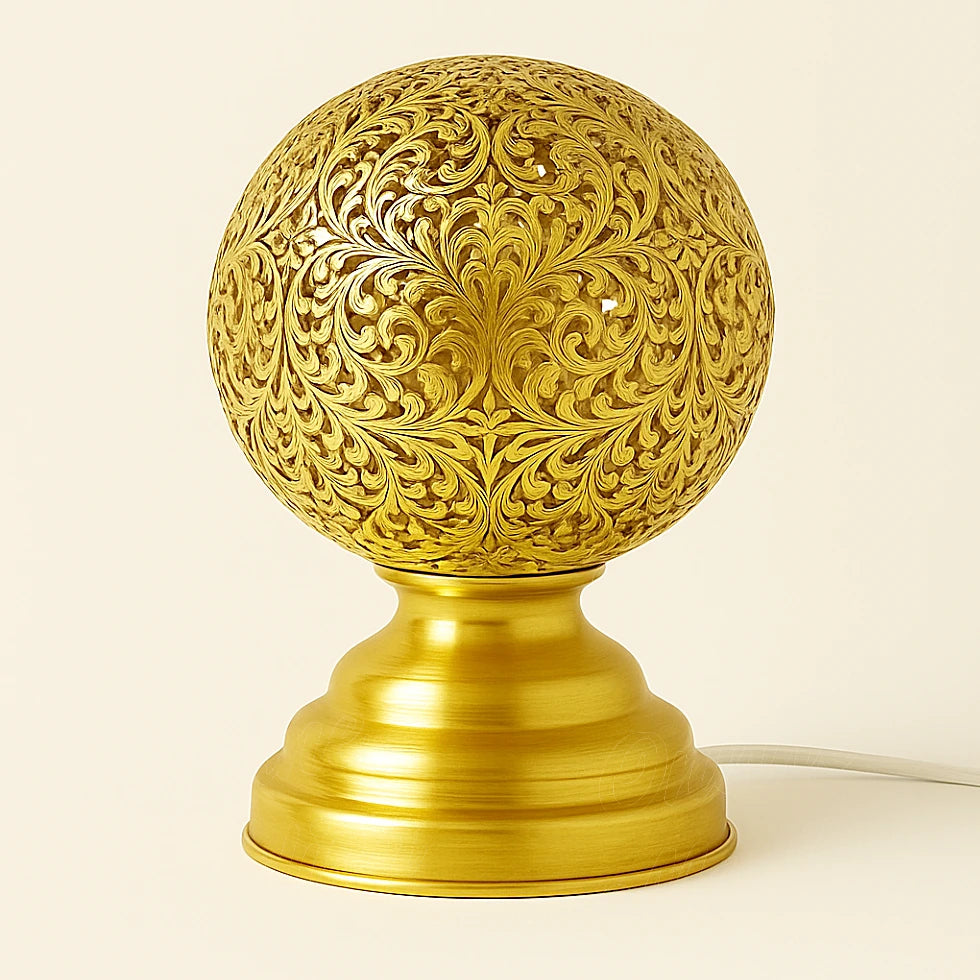 Handmade Moroccan brass globe lamp with intricate floral cutwork, polished finish