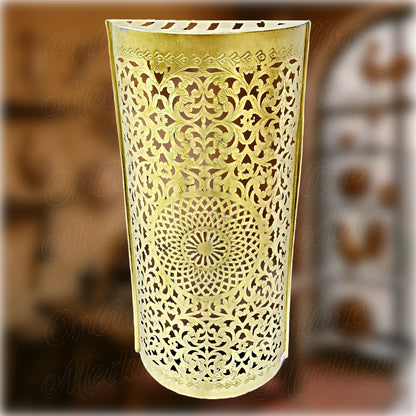 Handcrafted Moroccan wall light fixture made of polished brass, featuring intricate floral cutwork and traditional pierced patterns – elegant sconce for soft ambient lighting.