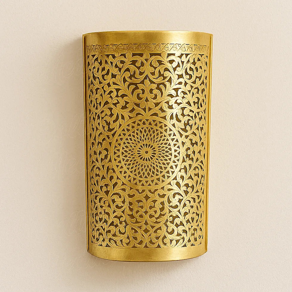 Moroccan brass wall light with intricate floral cutwork design handcrafted by artisan in Marrakech