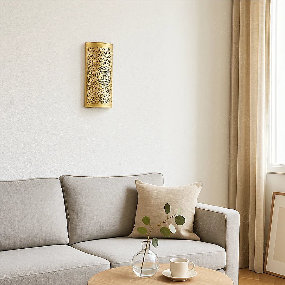 Brass Moroccan wall sconce in a modern living room with neutral beige sofa and natural light