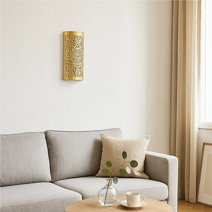 Brass Moroccan wall sconce in a modern living room with neutral beige sofa and natural light