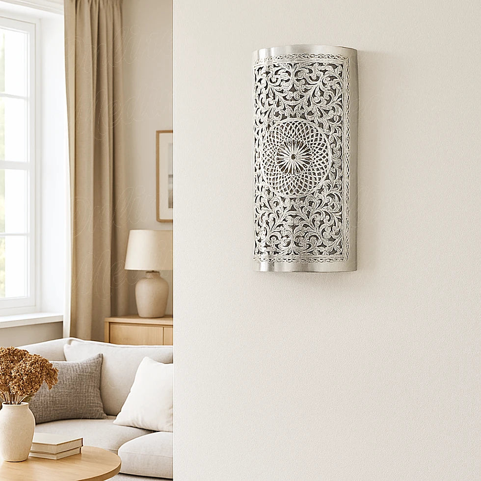 Silver Moroccan wall sconce in contemporary living room during daytime with beige tones and sunlight