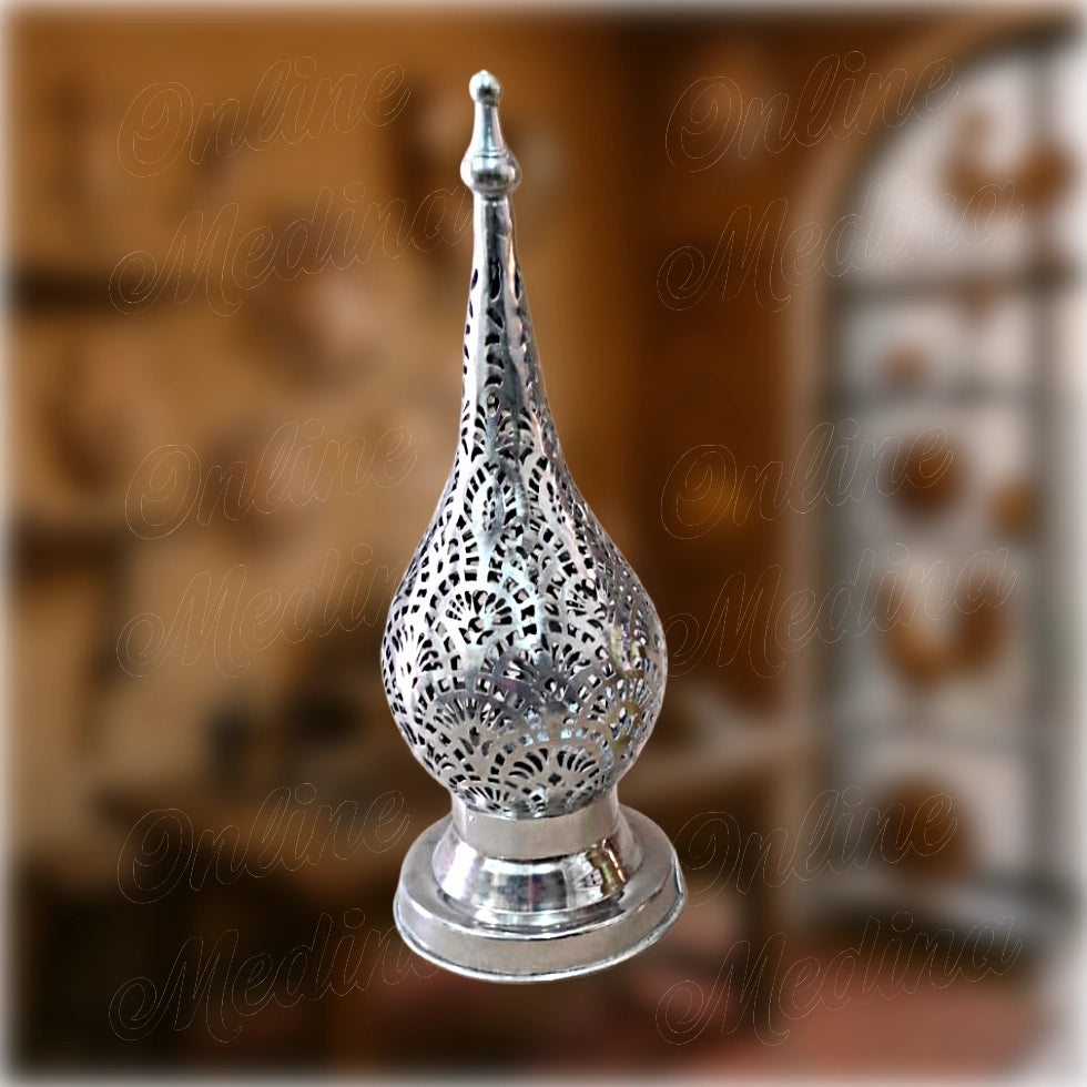 Silver Moroccan candle holder in teardrop shape with delicate floral cutouts – artisan-made by Maître Hilab in Marrakech