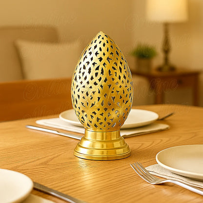 Brass Moroccan candle holder on a dining table, elegant handcrafted decor