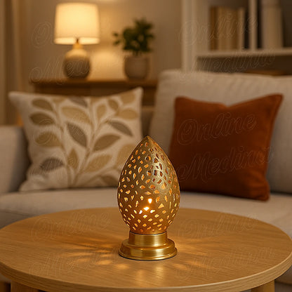 Lit brass Moroccan candle holder with pierced pattern, warm cozy living room atmosphere
