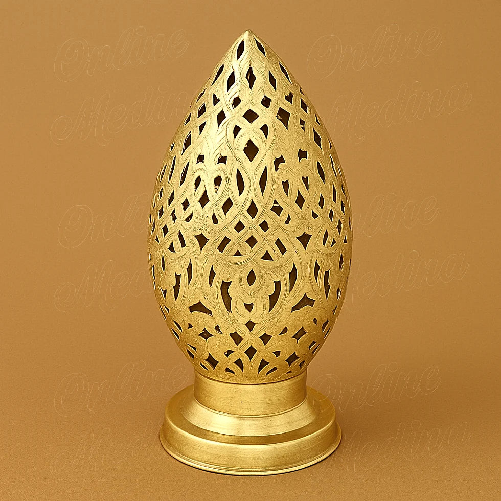 Brass Moroccan egg-shaped candle holder with floral cutouts, handcrafted metal decor