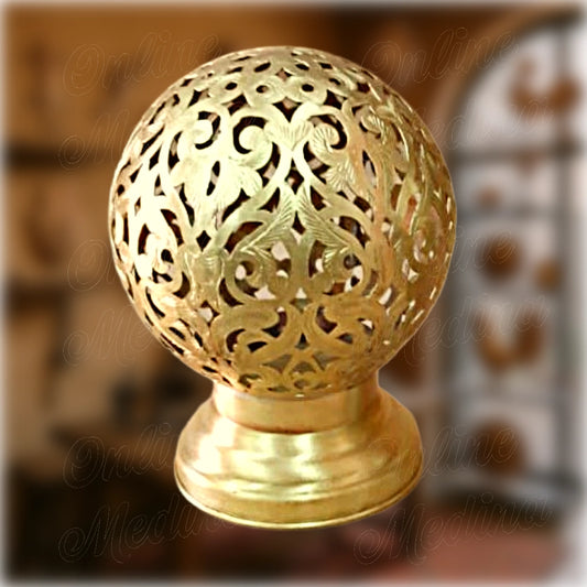 Spherical Moroccan brass candle holder with pierced floral pattern