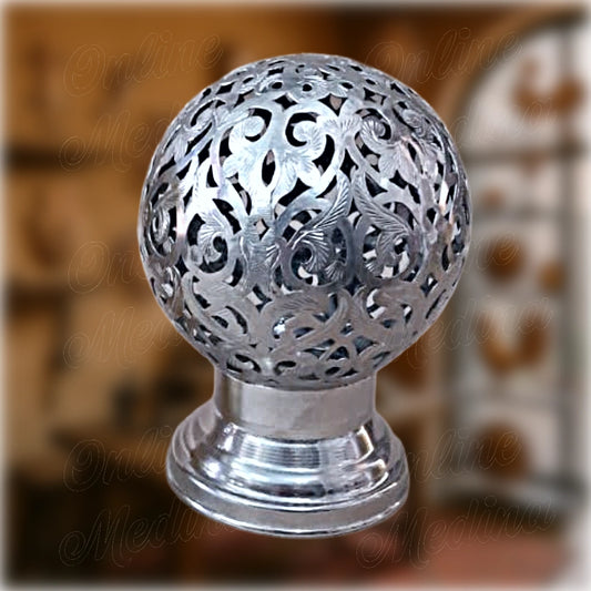 Spherical Moroccan silver candle holder with intricate pierced design