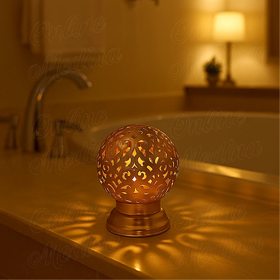 Lit brass Moroccan candle holder with pierced patterns in a cozy bathroom, romantic ambient lighting