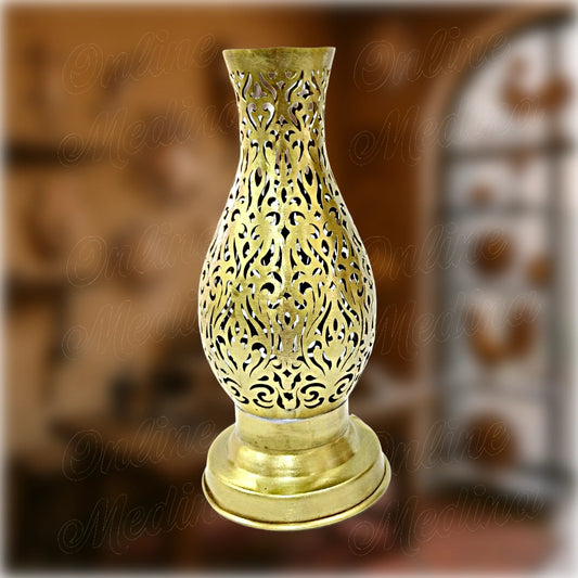 Moroccan brass vase shaped like an amphora candle holder with pierced floral motifs