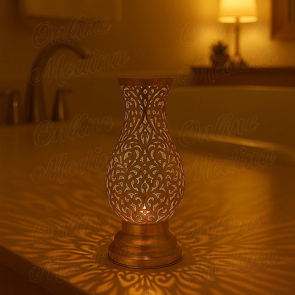 Lit Moroccan brass lantern creating warm light patterns in a bathroom