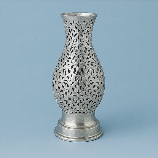 Handcrafted Moroccan silver amphora candle holder on a blue background