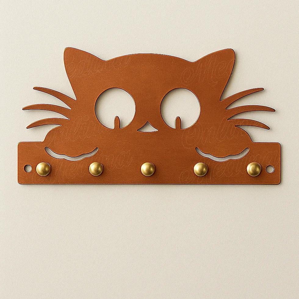 Copper cat-shaped wall key holder with five brass hooks on neutral wall