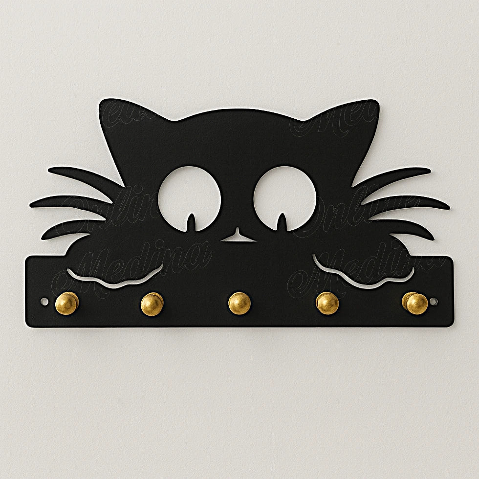 Black cat-shaped wall key holder with brass hooks on neutral wall