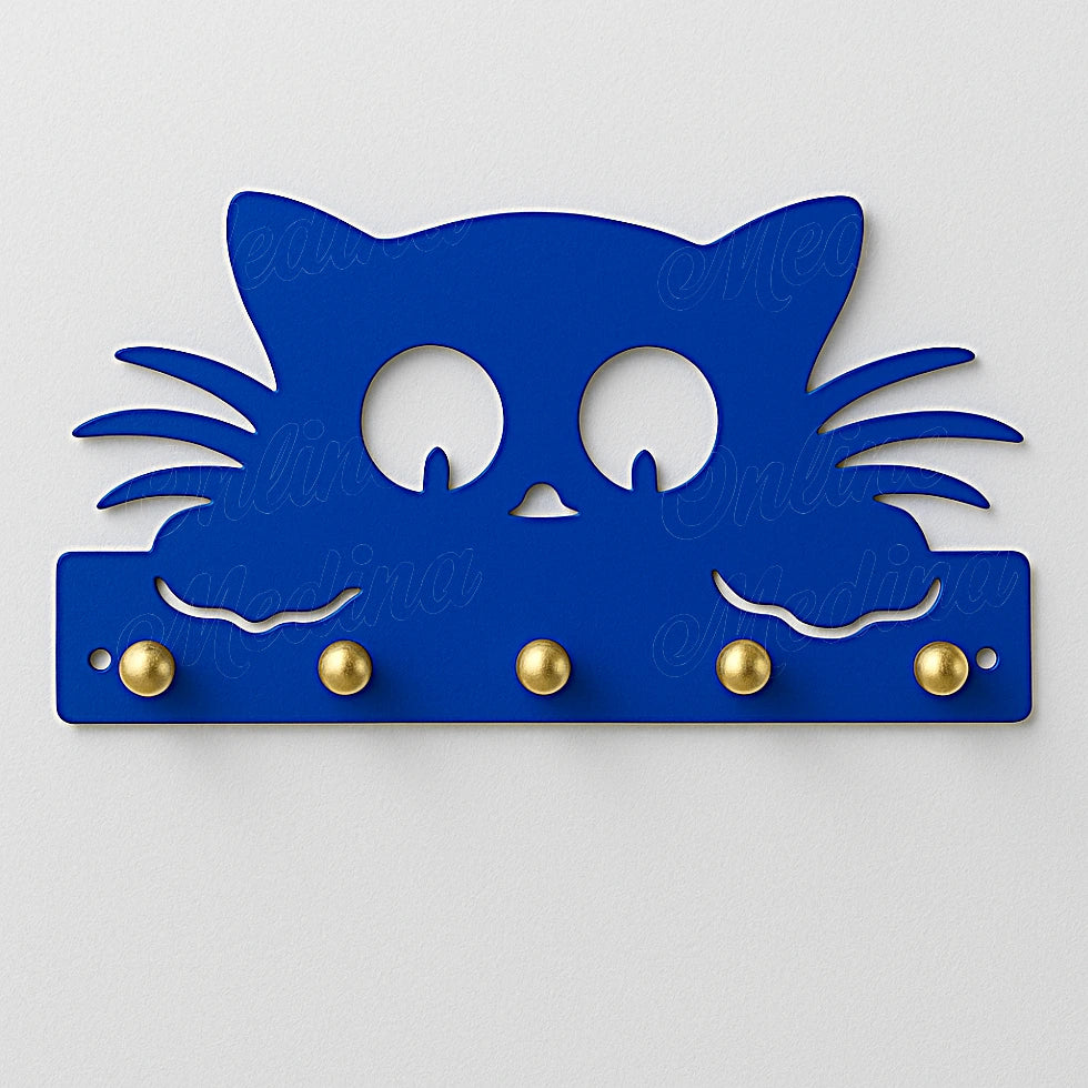 Majorelle blue cat-shaped wall key holder with brass hooks on light background