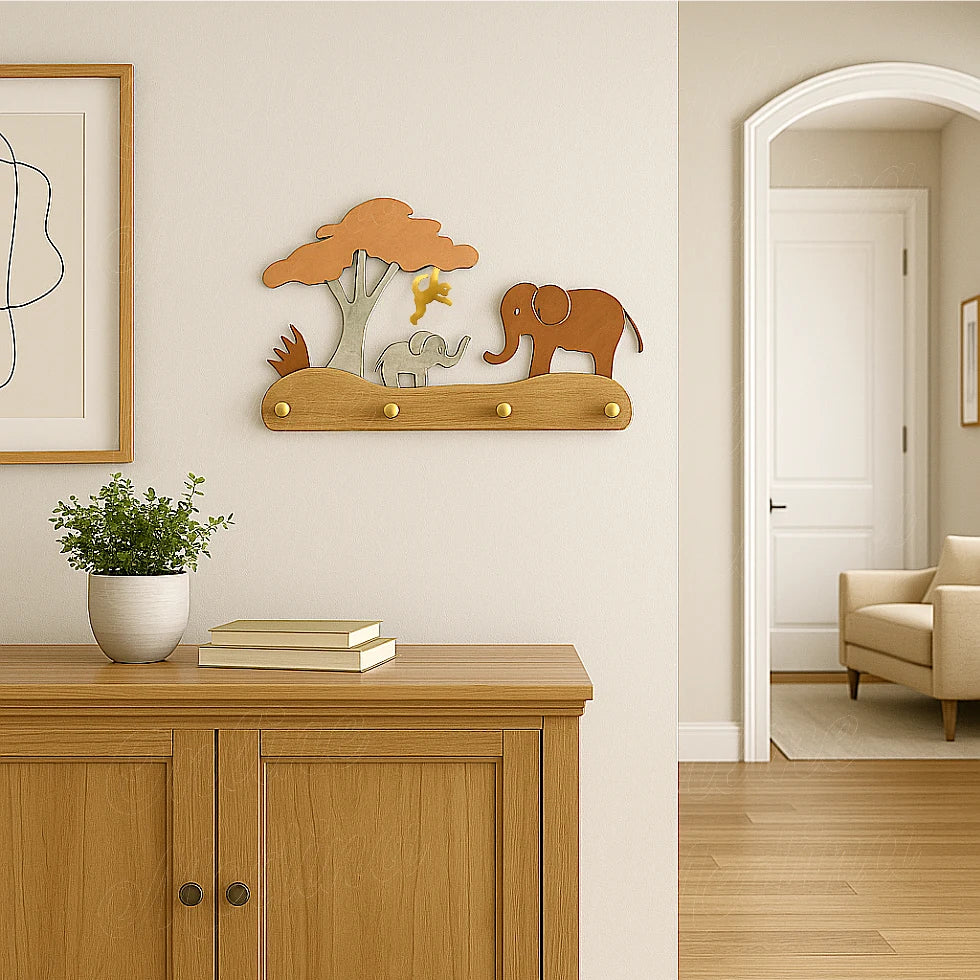 Metal elephant and tree coat rack displayed above wooden cabinet in bright hallway