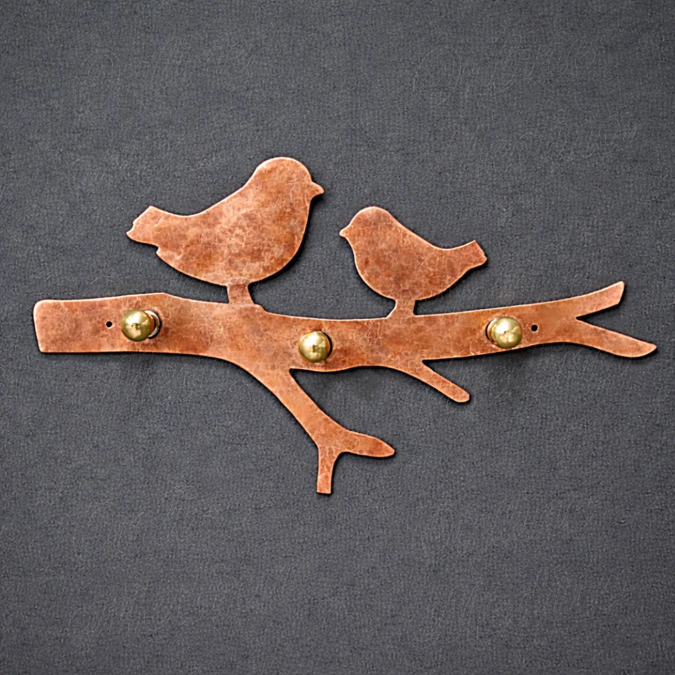 Handcrafted bird wall key holder in red copper metal with natural hammered texture and solid brass hooks