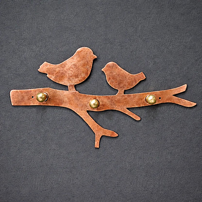 Handcrafted bird wall key holder in red copper metal with natural hammered texture and solid brass hooks