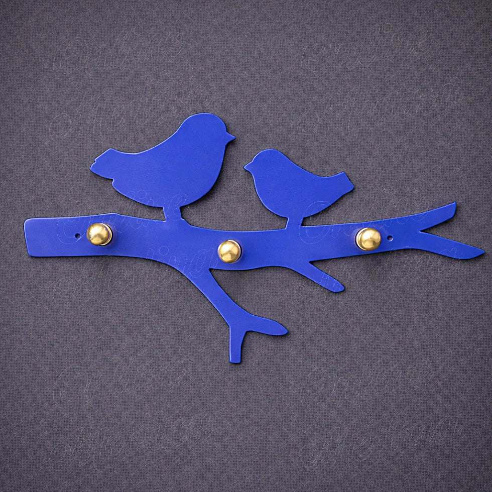 Blue galvanized bird wall key holder with brass hooks, handcrafted metal wall decor inspired by Moroccan craftsmanship