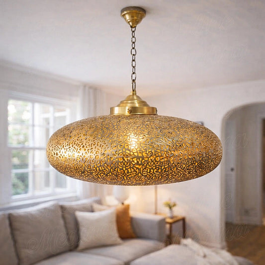 Moroccan brass saucer pendant lamp illuminating a living room
