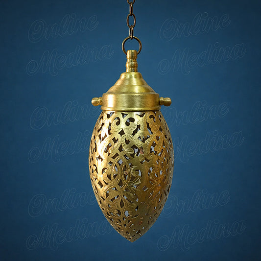 Small handmade Moroccan brass pendant light with openwork details on a deep blue solid background