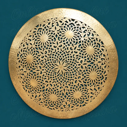 Round golden brass wall sconce with openwork floral rosettes and a wide hammered rim against a deep teal background.