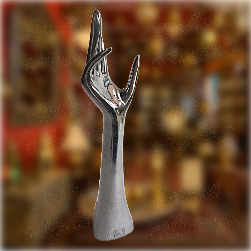 Engraved copper version of the artisan hand sculpture – traditional Moroccan metalwork with floral motifs and spiritual symbolism