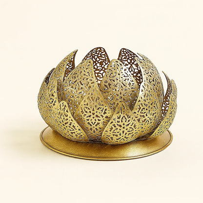 Handcrafted brass Moroccan lamp in a lotus flower shape, featuring intricate pierced metalwork and a slightly domed base, displayed on a plain beige background for e-commerce photography