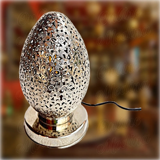 Oriental egg-shaped lamp handcrafted in silver-toned pierced metal – floral Moroccan design for soft ambient lighting